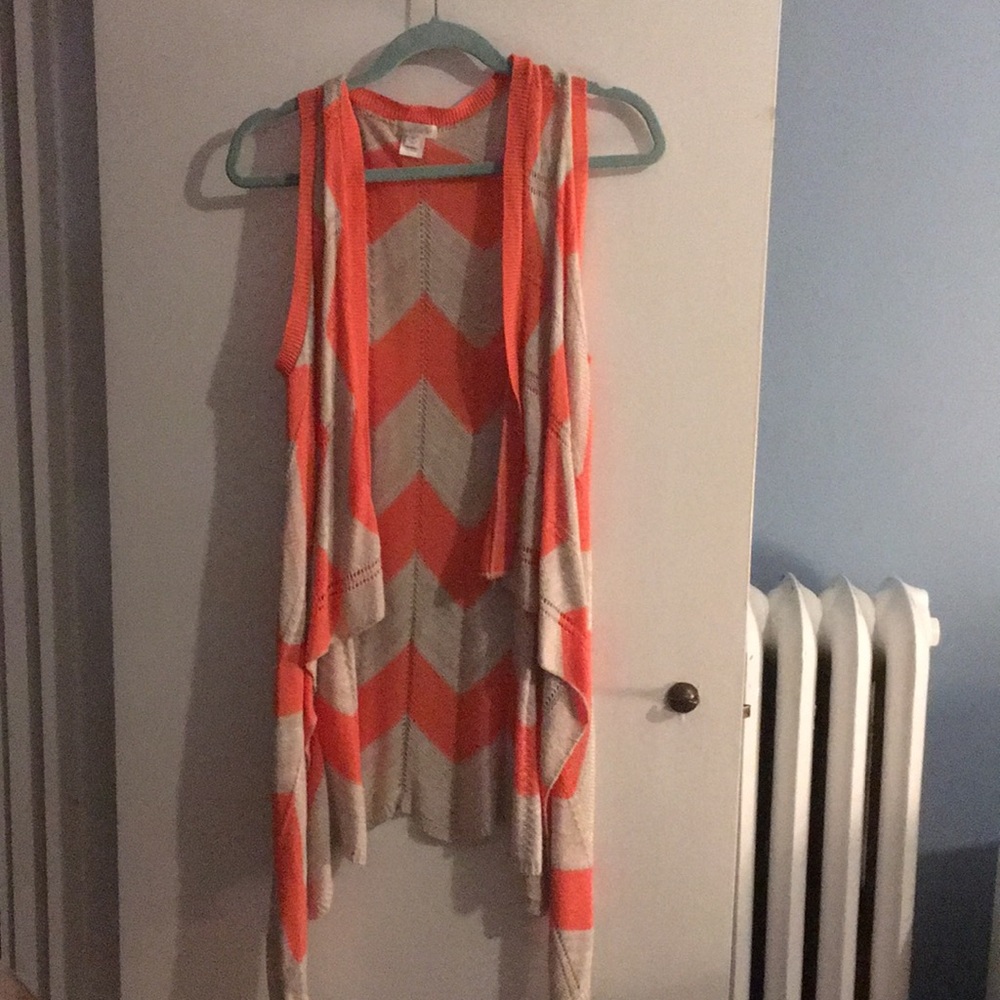 orange sleeveless sweater